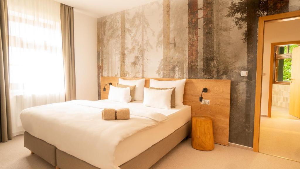 Postel nebo postele na pokoji v ubytování Hotel Soyka