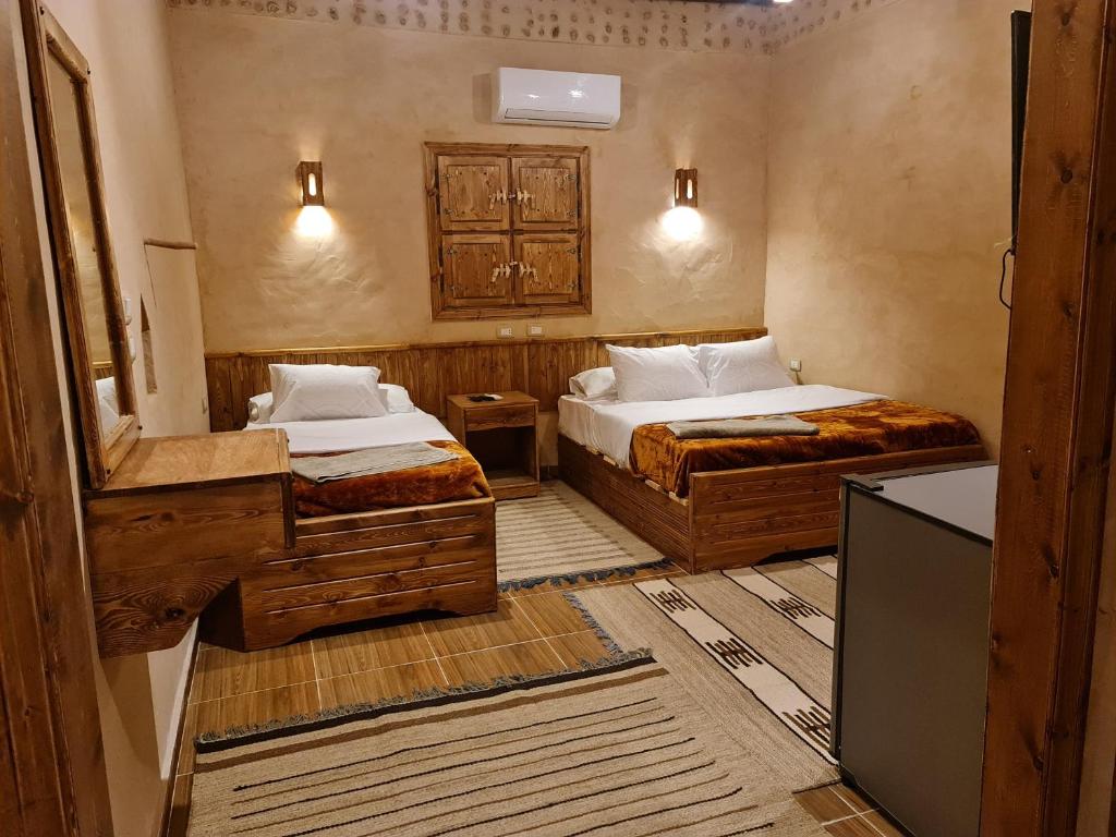 Postel nebo postele na pokoji v ubytování Qasr El salam