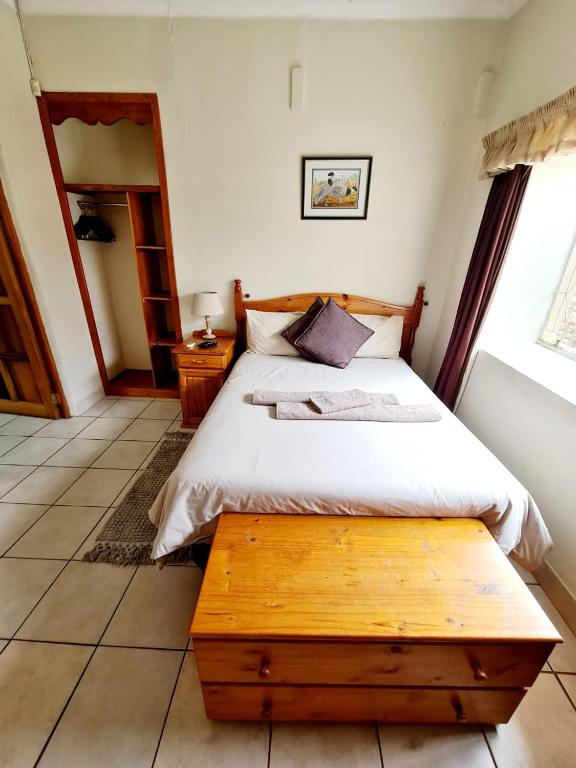 Postel nebo postele na pokoji v ubytování Resthaven Guesthouse
