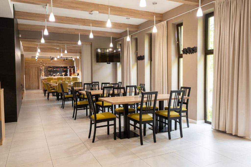 Reštaurácia alebo iné gastronomické zariadenie v ubytovaní Penzión Kolkáreň
