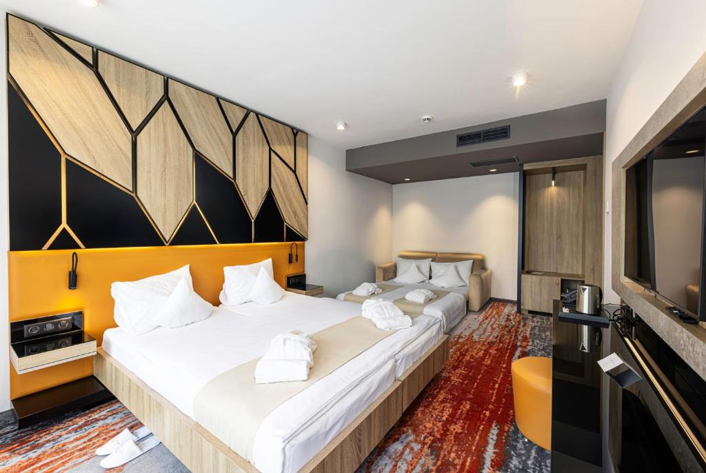 Postel nebo postele na pokoji v ubytování Avar Hotel