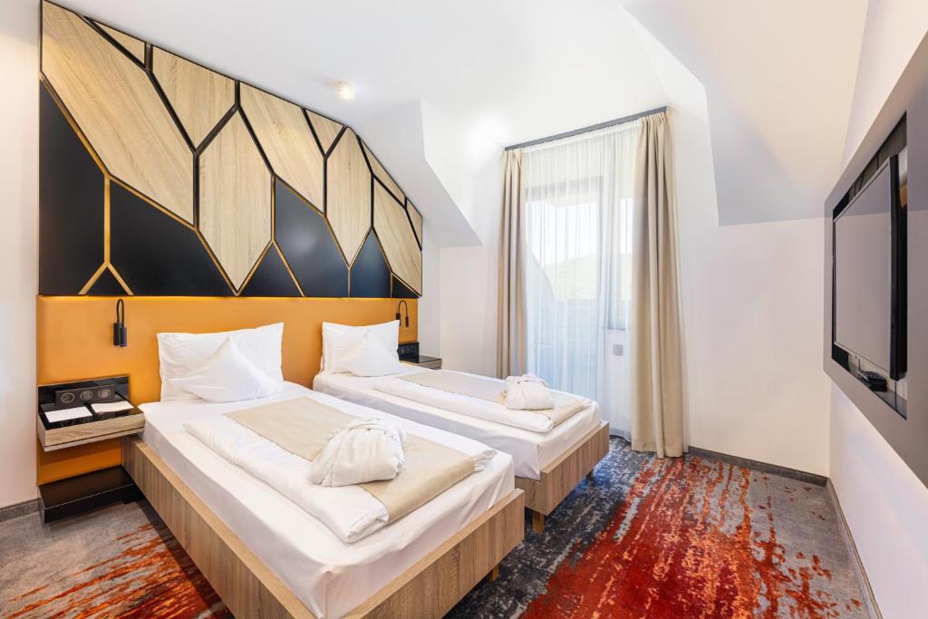 Postel nebo postele na pokoji v ubytování Avar Hotel