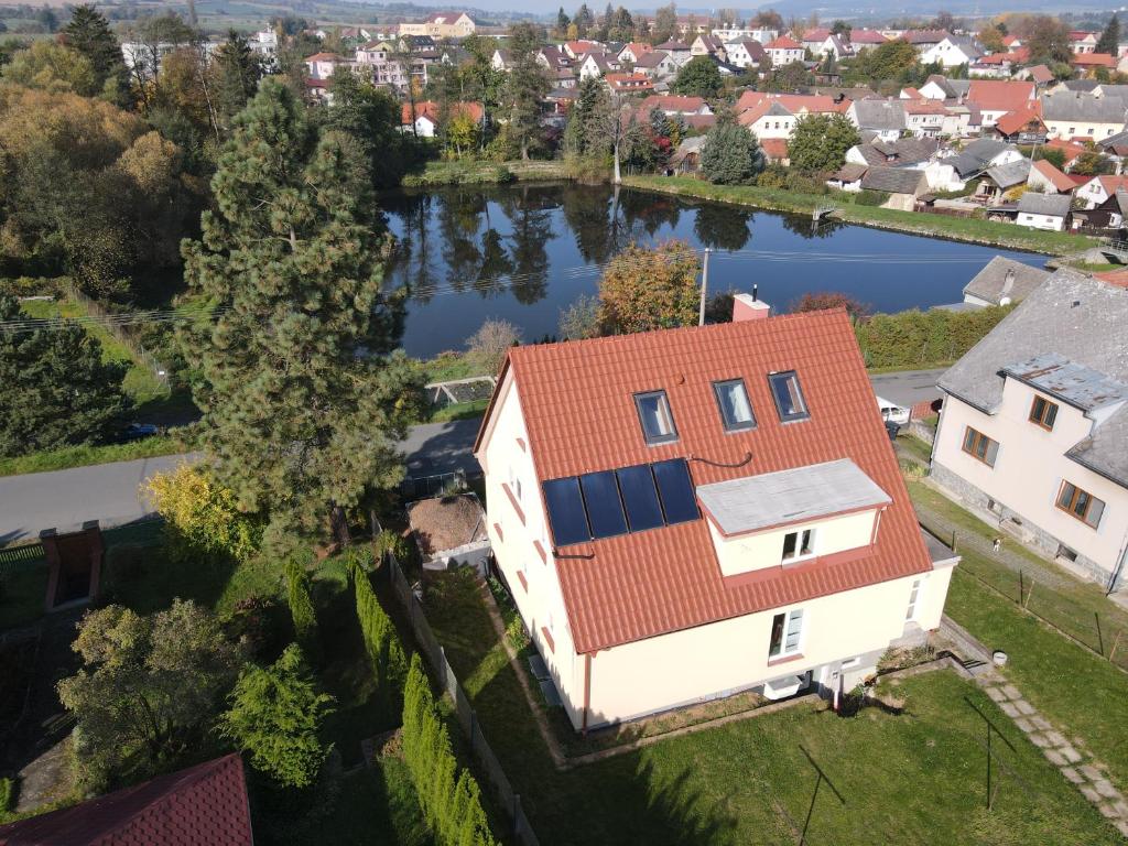 an aerial view of a house with a red roof at Apartmány U Mirase in Sedlec