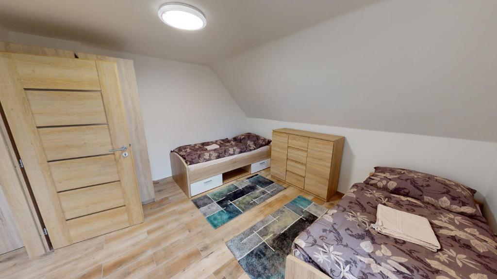 Postel nebo postele na pokoji v ubytování Apartmány U Mirase