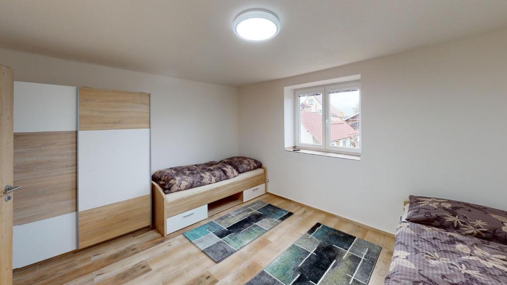 Postel nebo postele na pokoji v ubytování Apartmány U Mirase