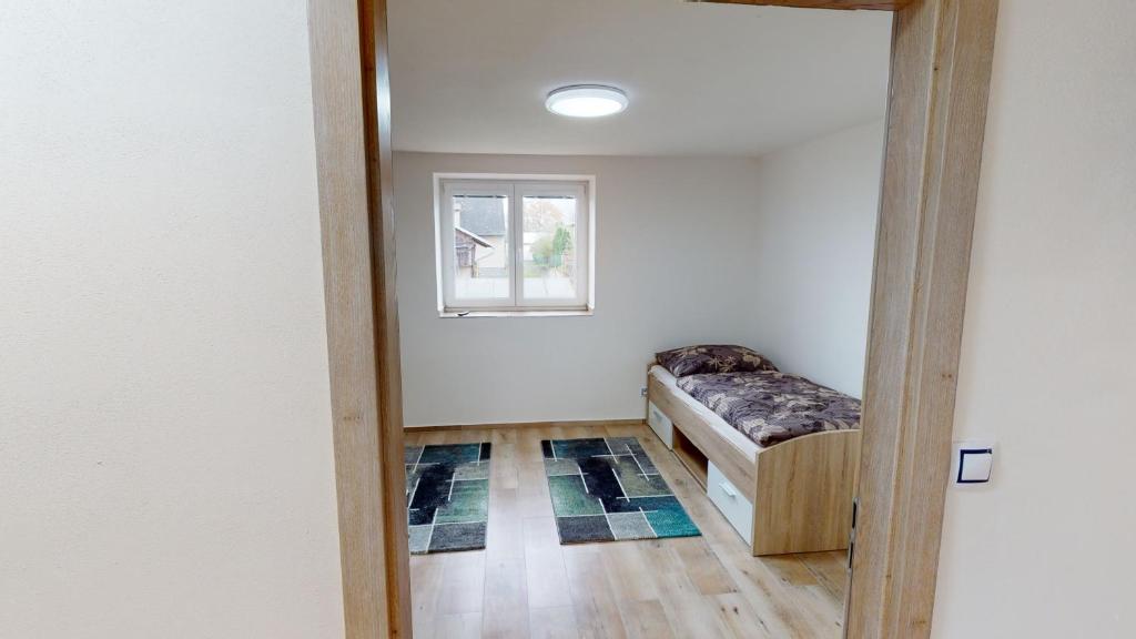 Postel nebo postele na pokoji v ubytování Apartmány U Mirase
