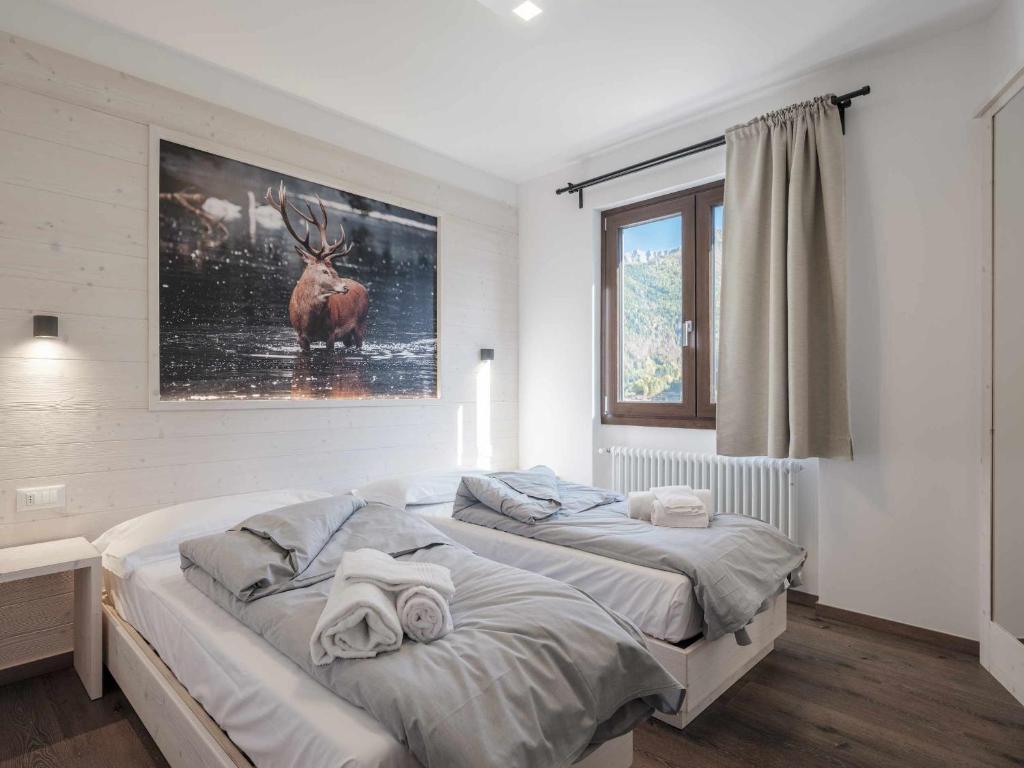 Postel nebo postele na pokoji v ubytování Hotel Garnì Alta Valle