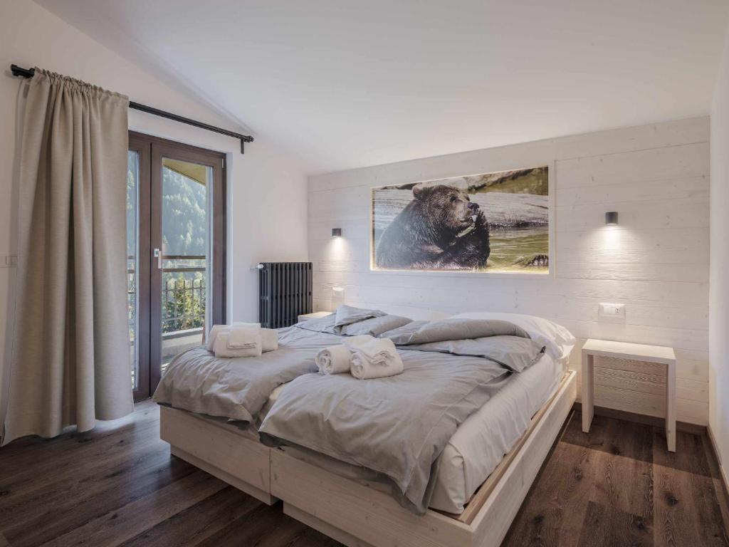 Postel nebo postele na pokoji v ubytování Hotel Garnì Alta Valle