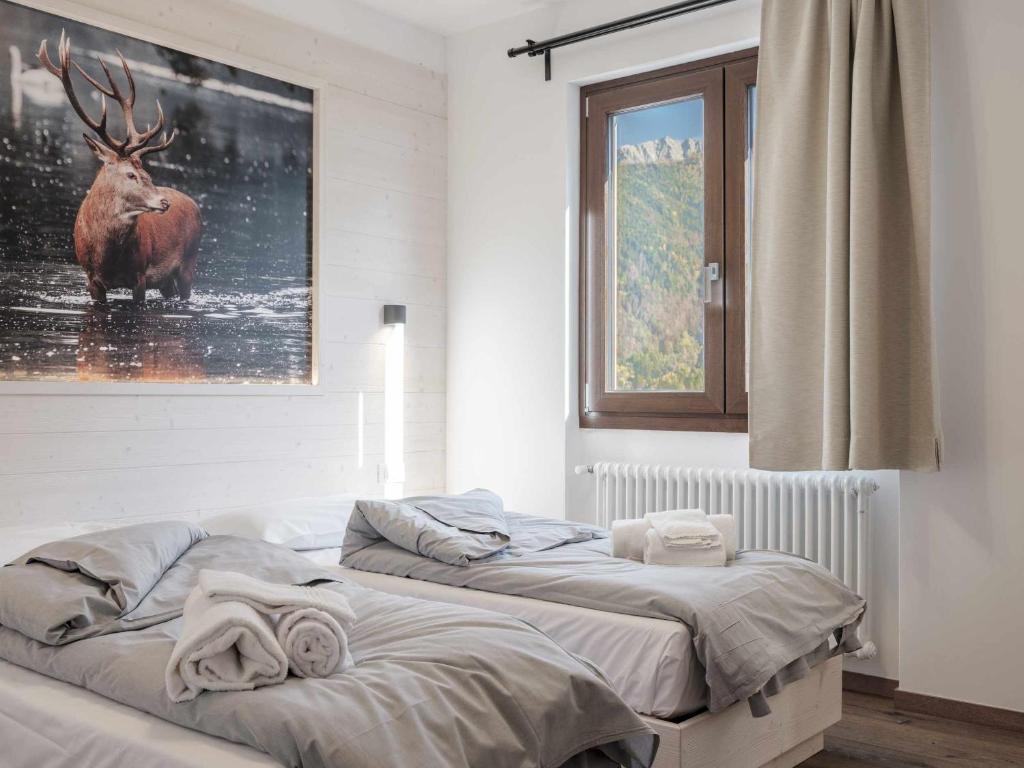 Postel nebo postele na pokoji v ubytování Hotel Garnì Alta Valle