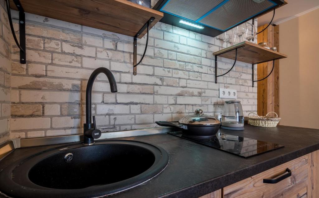 Kuchyň nebo kuchyňský kout v ubytování New Gudauri Atrium apartment #233
