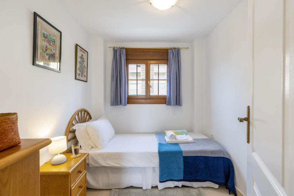 Postel nebo postele na pokoji v ubytování La Isla Penthouse