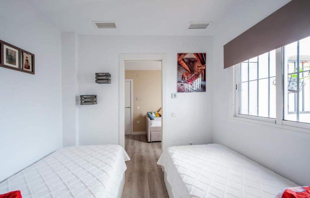 Postel nebo postele na pokoji v ubytování Casa Valentina: Confort y Luz en Sevilla Centro