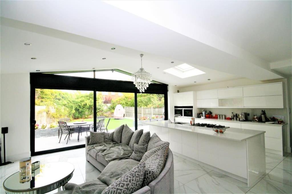 a kitchen and living room with a couch and a table at Stunning executive style property. in Crosby