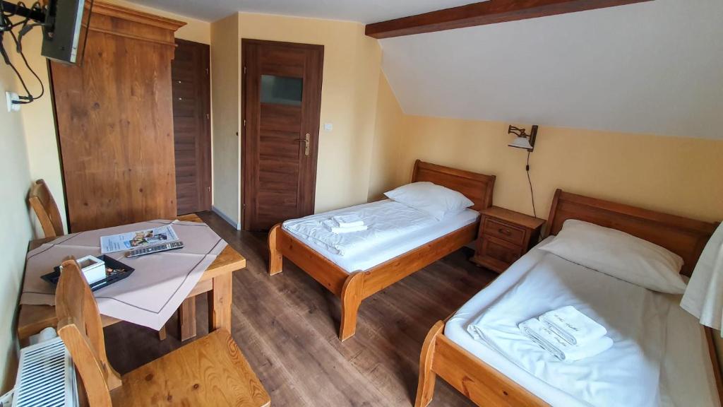 Postel nebo postele na pokoji v ubytování Willa Białka