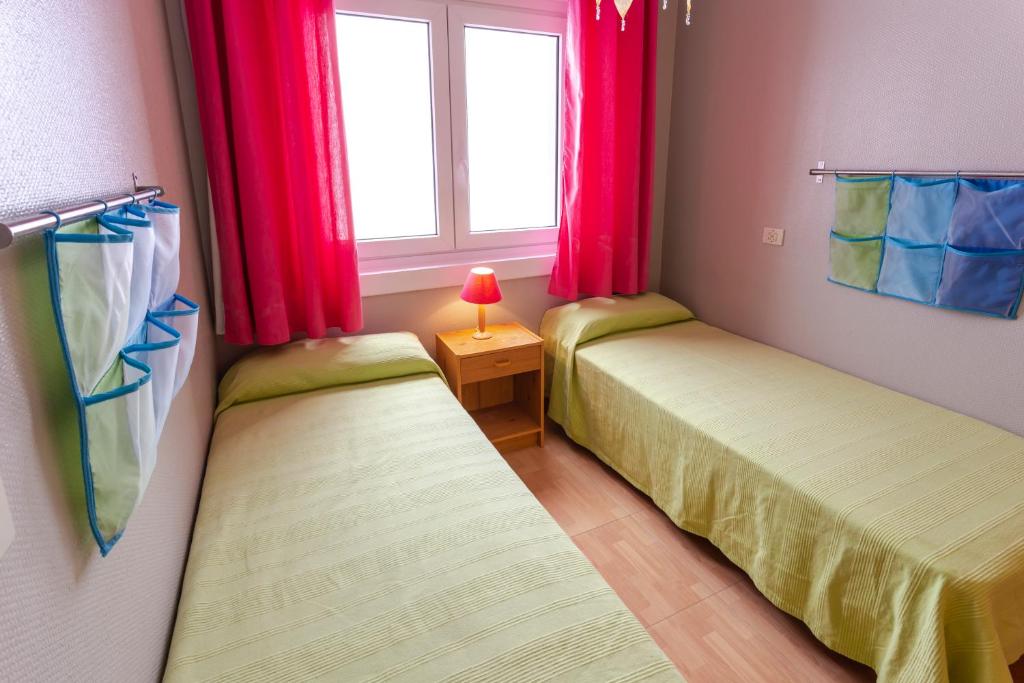 Postel nebo postele na pokoji v ubytování Meritxell Pedrous