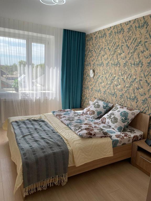 Llit o llits en una habitació de Вип апартамент Хусаинова 157