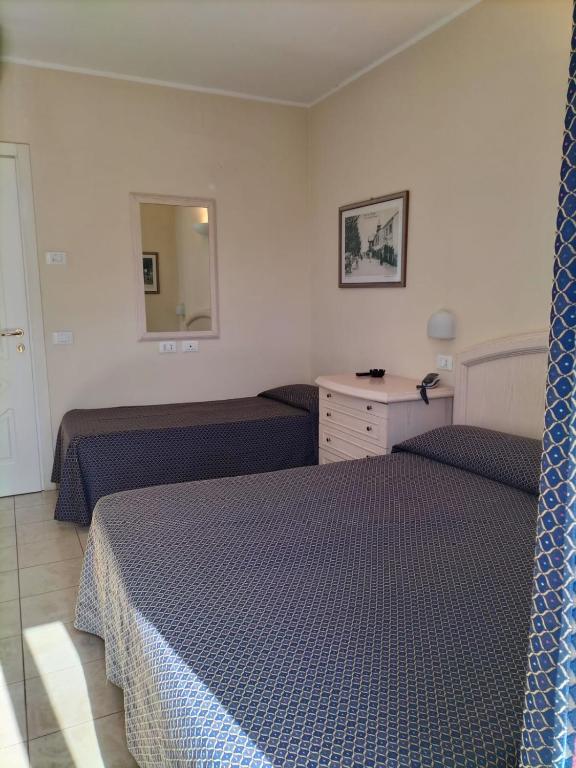 Postel nebo postele na pokoji v ubytování Hotel Villa Mare