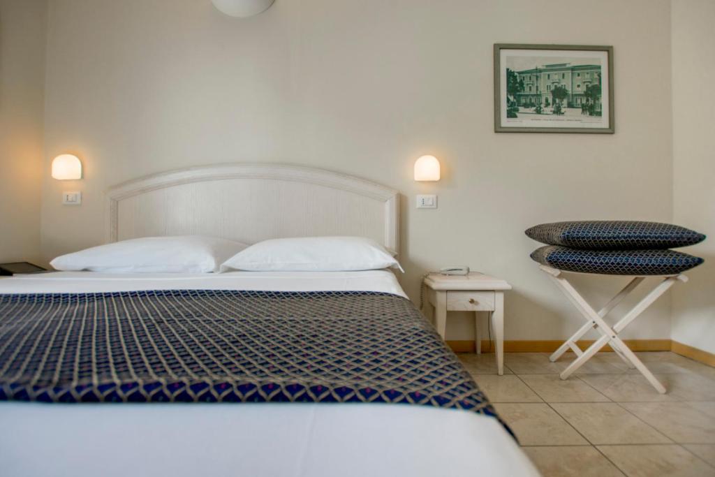 Postel nebo postele na pokoji v ubytování Hotel Villa Mare