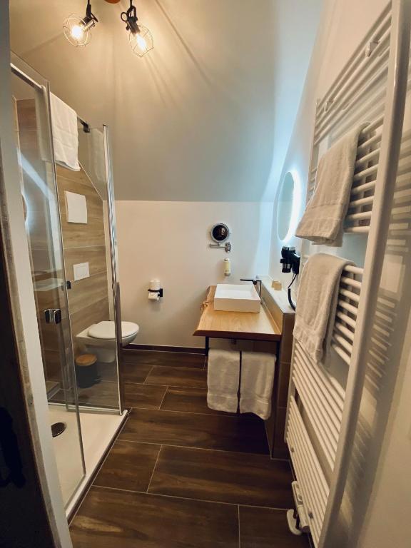 Koupelna v ubytování Hotel Le Filou