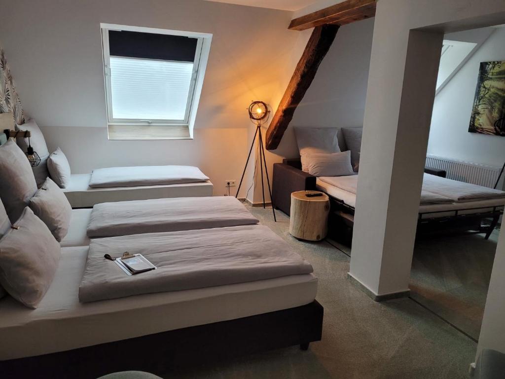 Postel nebo postele na pokoji v ubytování Hotel Le Filou