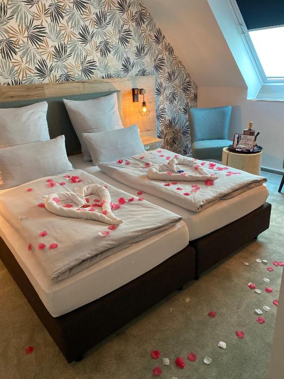 Postel nebo postele na pokoji v ubytování Hotel Le Filou