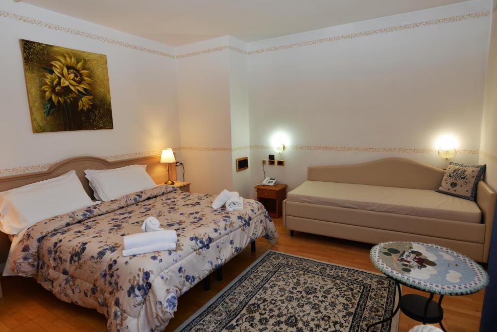 Postel nebo postele na pokoji v ubytování Hotel Marianna