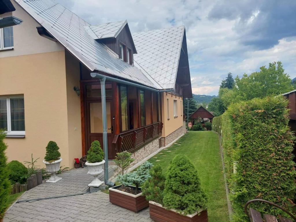 an aerial view of a house with a garden at PENZIÓN U JANOSIKA in Terchová