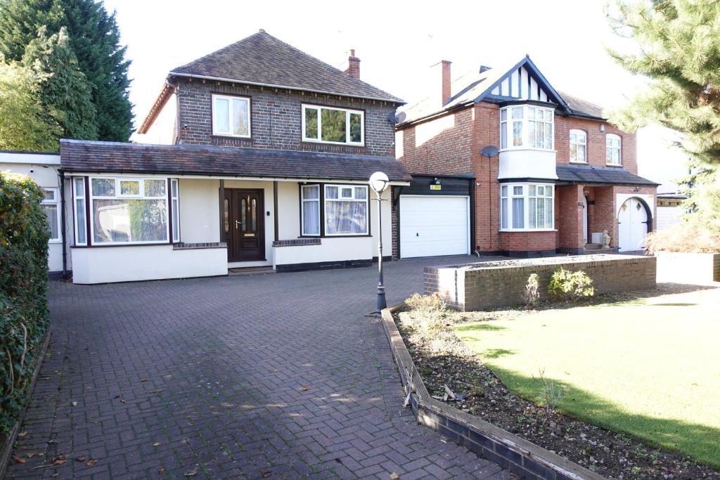 a house with a brick driveway in front of it at Huge 9 Bed Property Sleeps 17, Near NEC, City Centre, HS2 in Birmingham