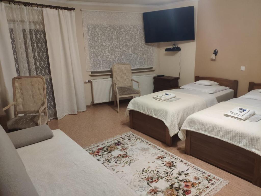Postel nebo postele na pokoji v ubytování Pod Skrzydłami Podlasia