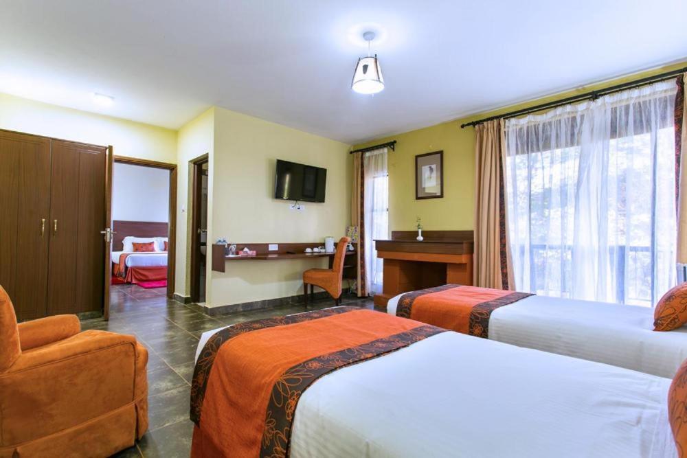 Postel nebo postele na pokoji v ubytování Sagana Getaway Resort