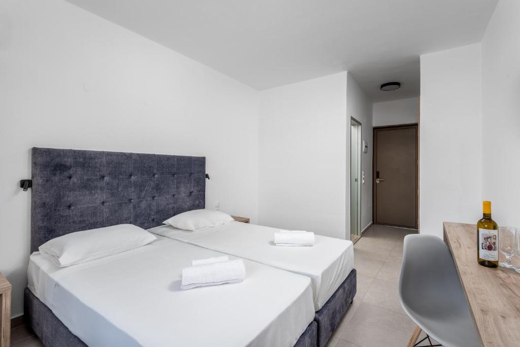 A bed or beds in a room at Afandou Blu