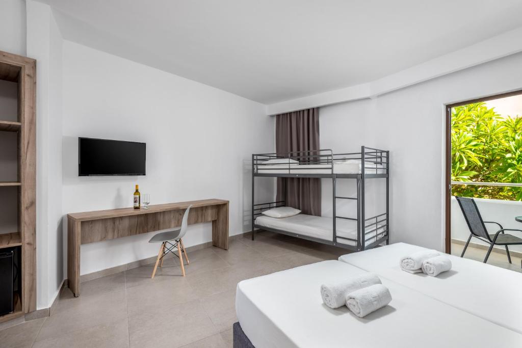A bed or beds in a room at Afandou Blu