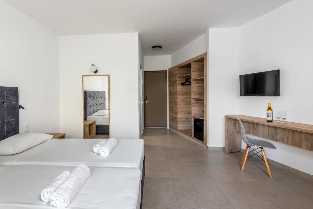 A television and/or entertainment centre at Afandou Blu