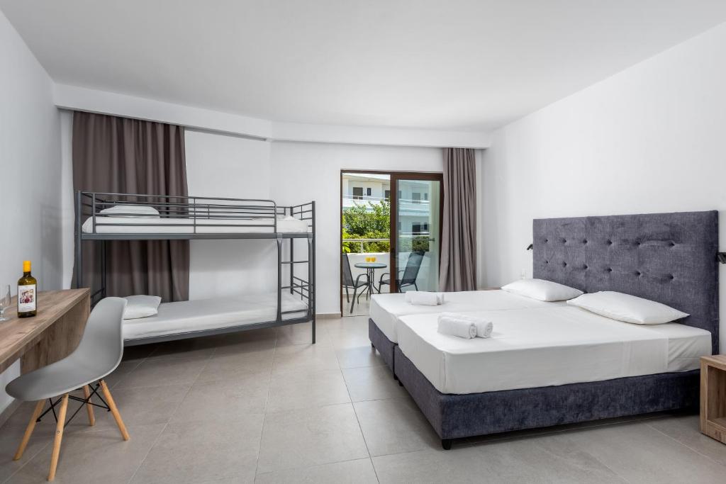 A bed or beds in a room at Afandou Blu