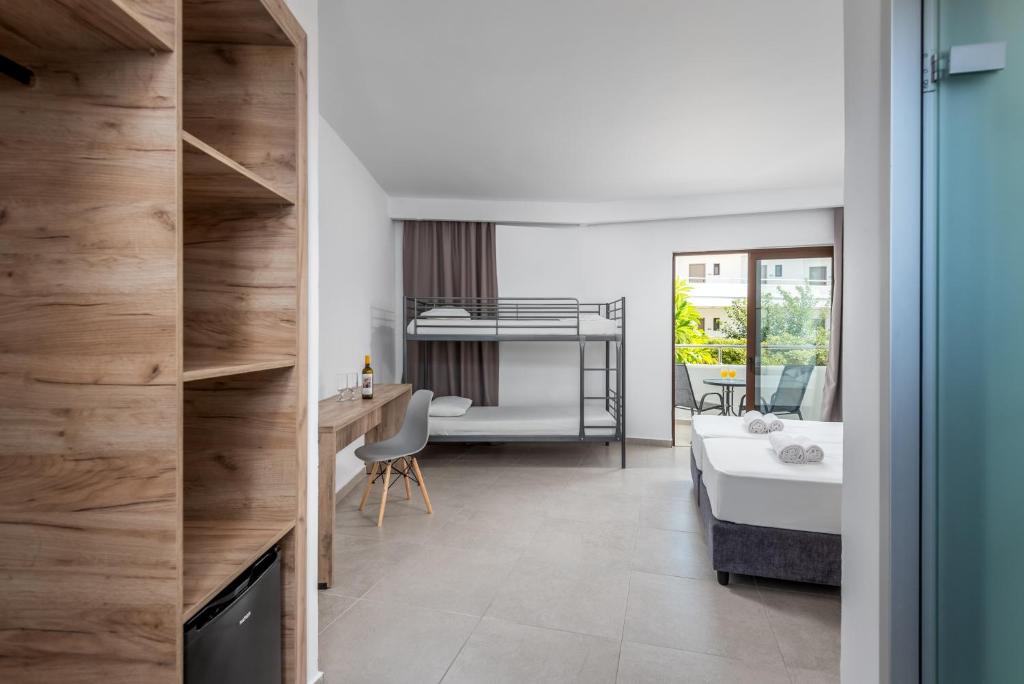 A bed or beds in a room at Afandou Blu