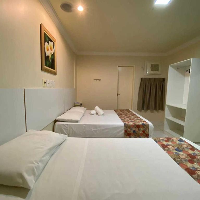 Postel nebo postele na pokoji v ubytování Hotel Monte Rei