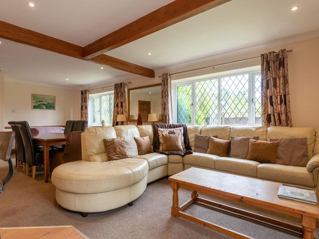 a living room with a couch and a table at Riverside Cottage-uk41439 in Brandon