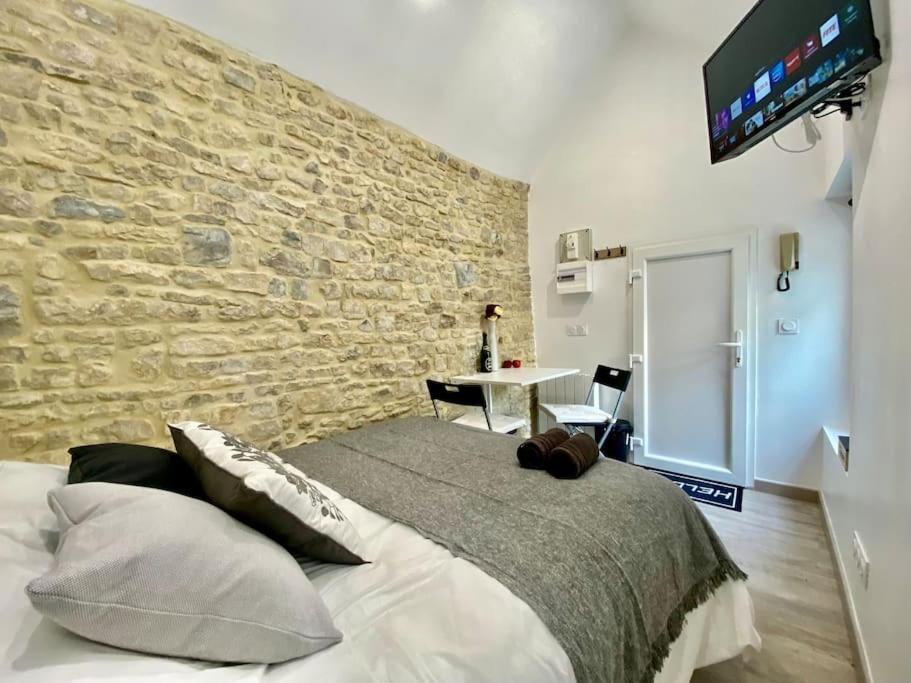 Posteľ alebo postele v izbe v ubytovaní Bed in the city - APPART’HOTEL - Historical center