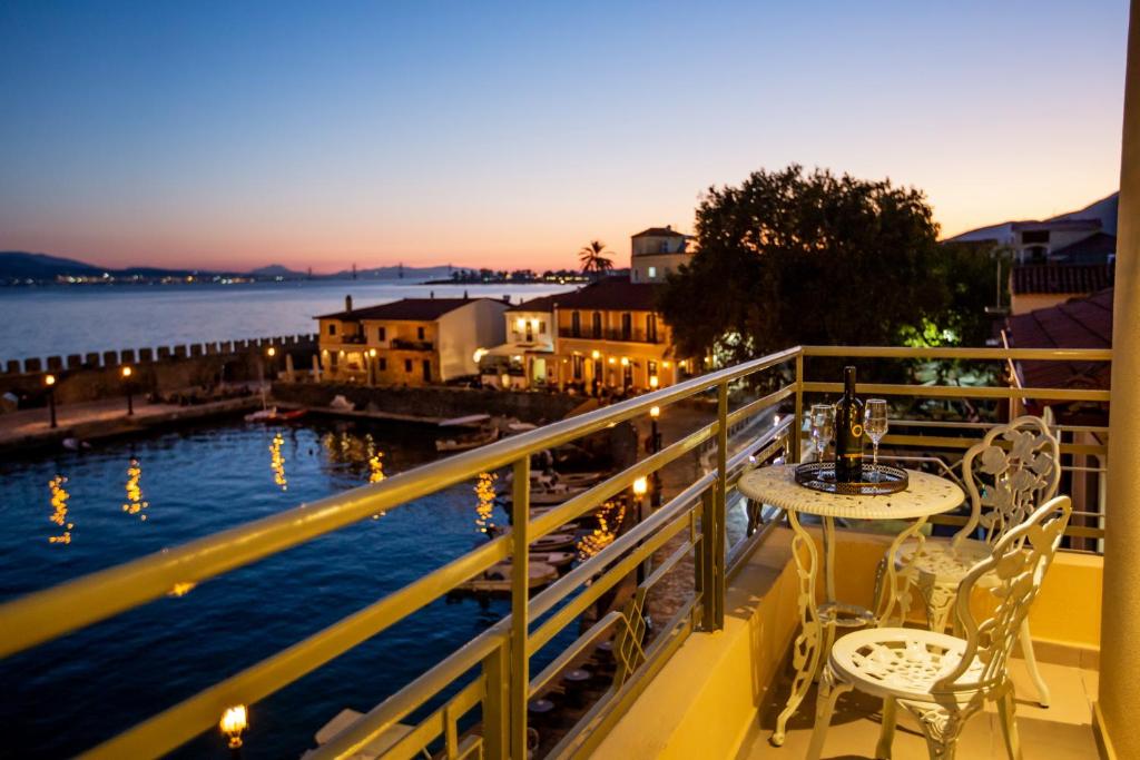 a balcony with a view of the water at Vip Lepanto Port Suites in Nafpaktos