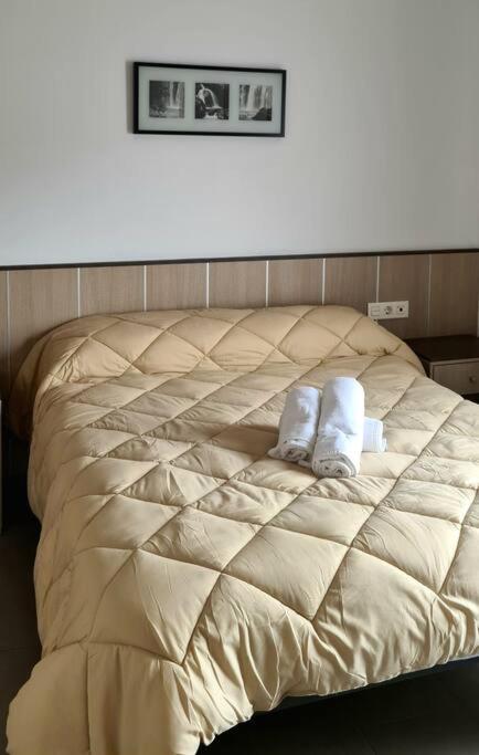 A bed or beds in a room at Ático dúplex Gran Vía Granada