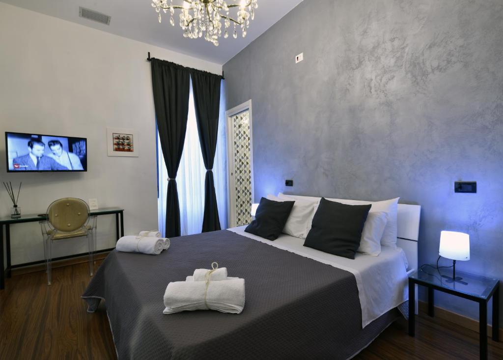 Postel nebo postele na pokoji v ubytování Frizzo House