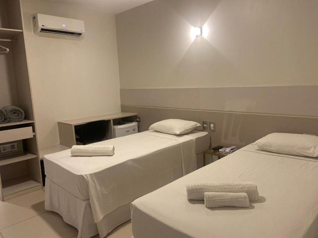 Postel nebo postele na pokoji v ubytování Uno Hotel