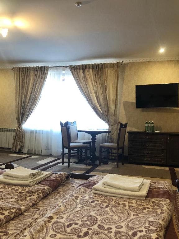 Postel nebo postele na pokoji v ubytování Hotel Ashad