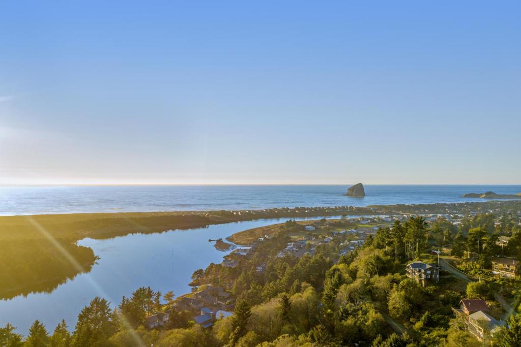 an aerial view of the shoreline of a beach and the ocean at Alta Vista in Pacific City