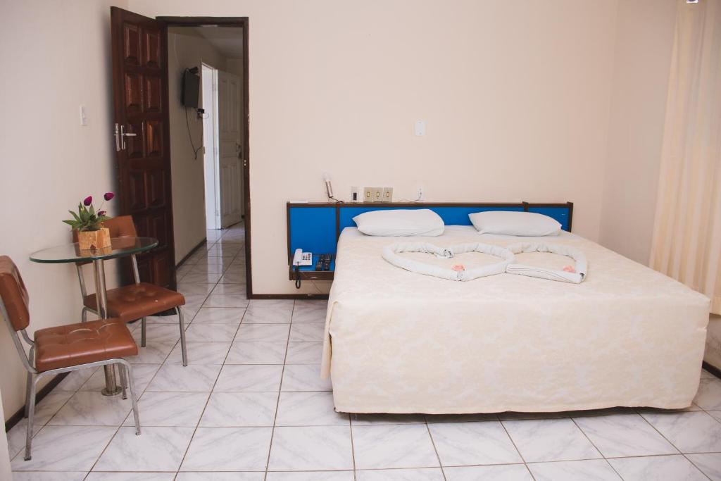Postel nebo postele na pokoji v ubytování CALDAS PALACE HOTEL JORRO