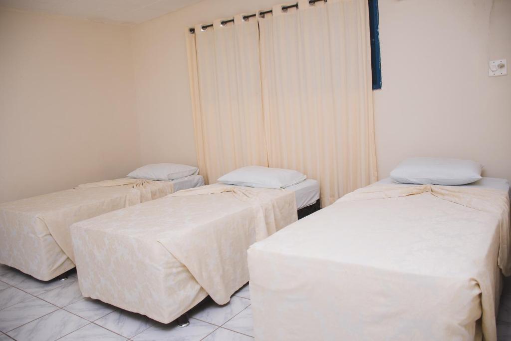 Postel nebo postele na pokoji v ubytování CALDAS PALACE HOTEL JORRO