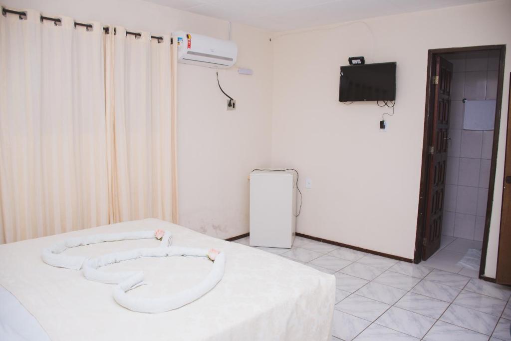 TV a/nebo společenská místnost v ubytování CALDAS PALACE HOTEL JORRO