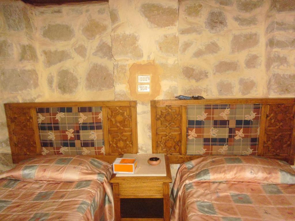 Postel nebo postele na pokoji v ubytování Aliyah Eco-Lodge