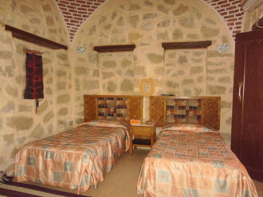 Postel nebo postele na pokoji v ubytování Aliyah Eco-Lodge