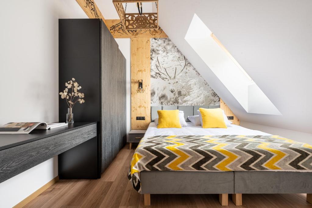 Posteľ alebo postele v izbe v ubytovaní STACJA NOSAL Apartamenty